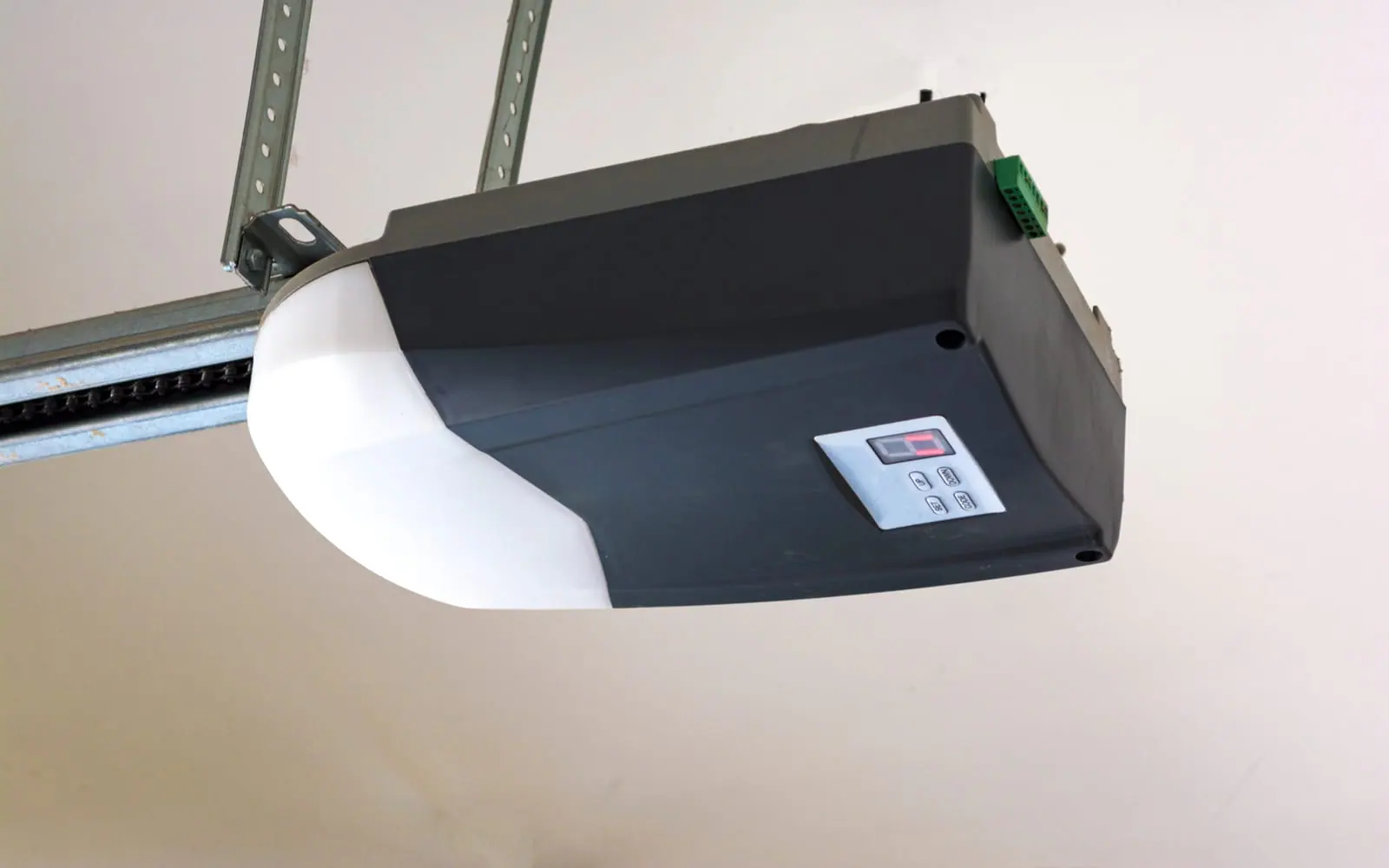 Garage door opener motor mounted on the ceiling