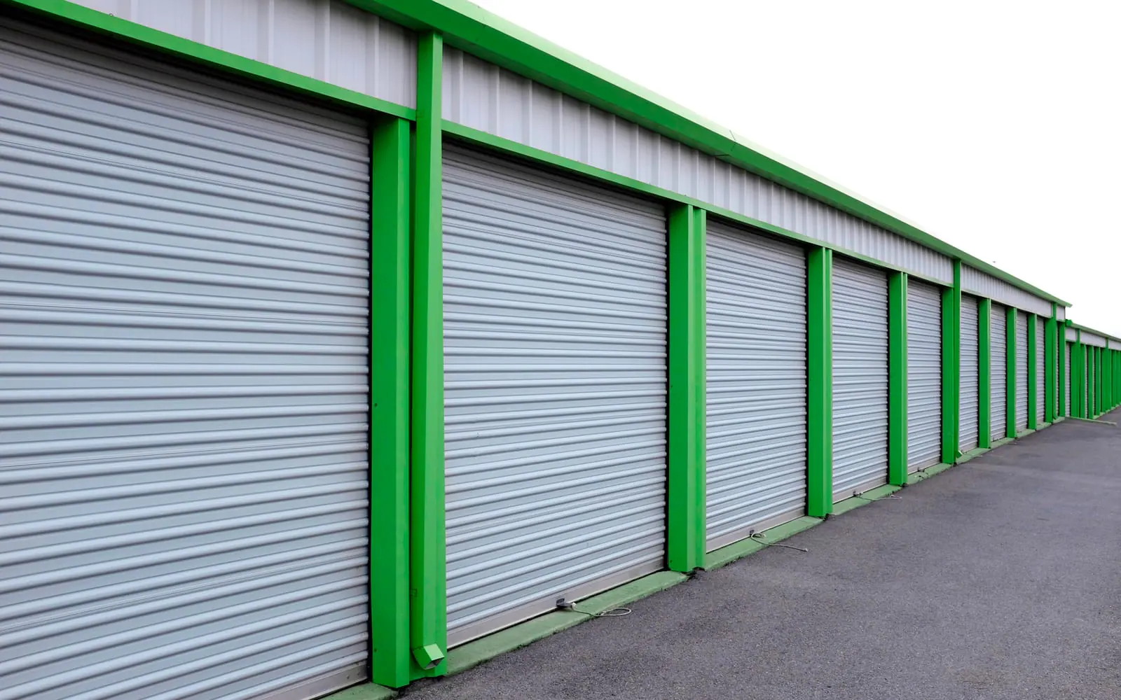 Row of storage units with roll-up doors