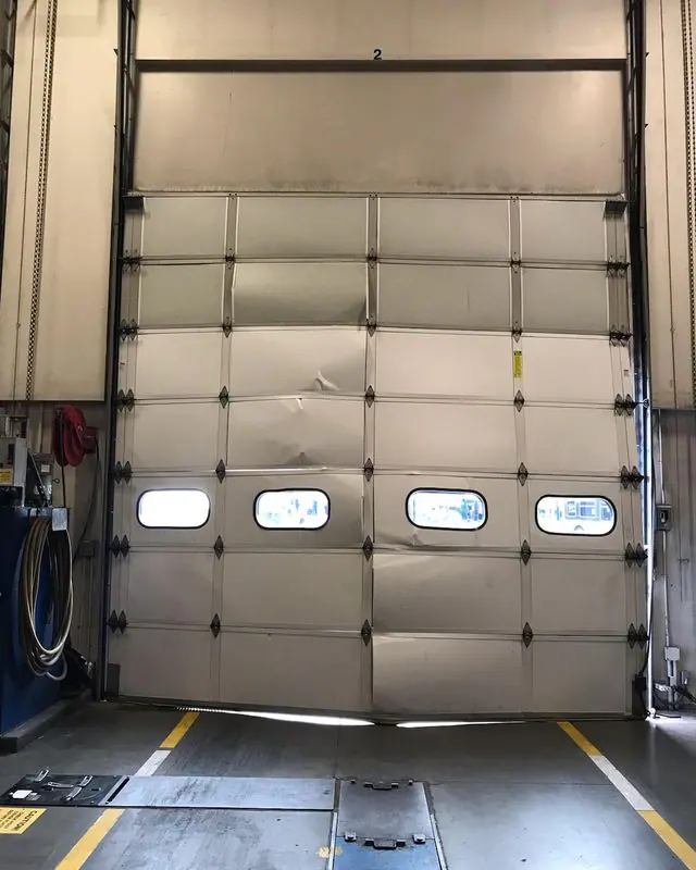 Loading dock door crushed at the bottom, seen from inside