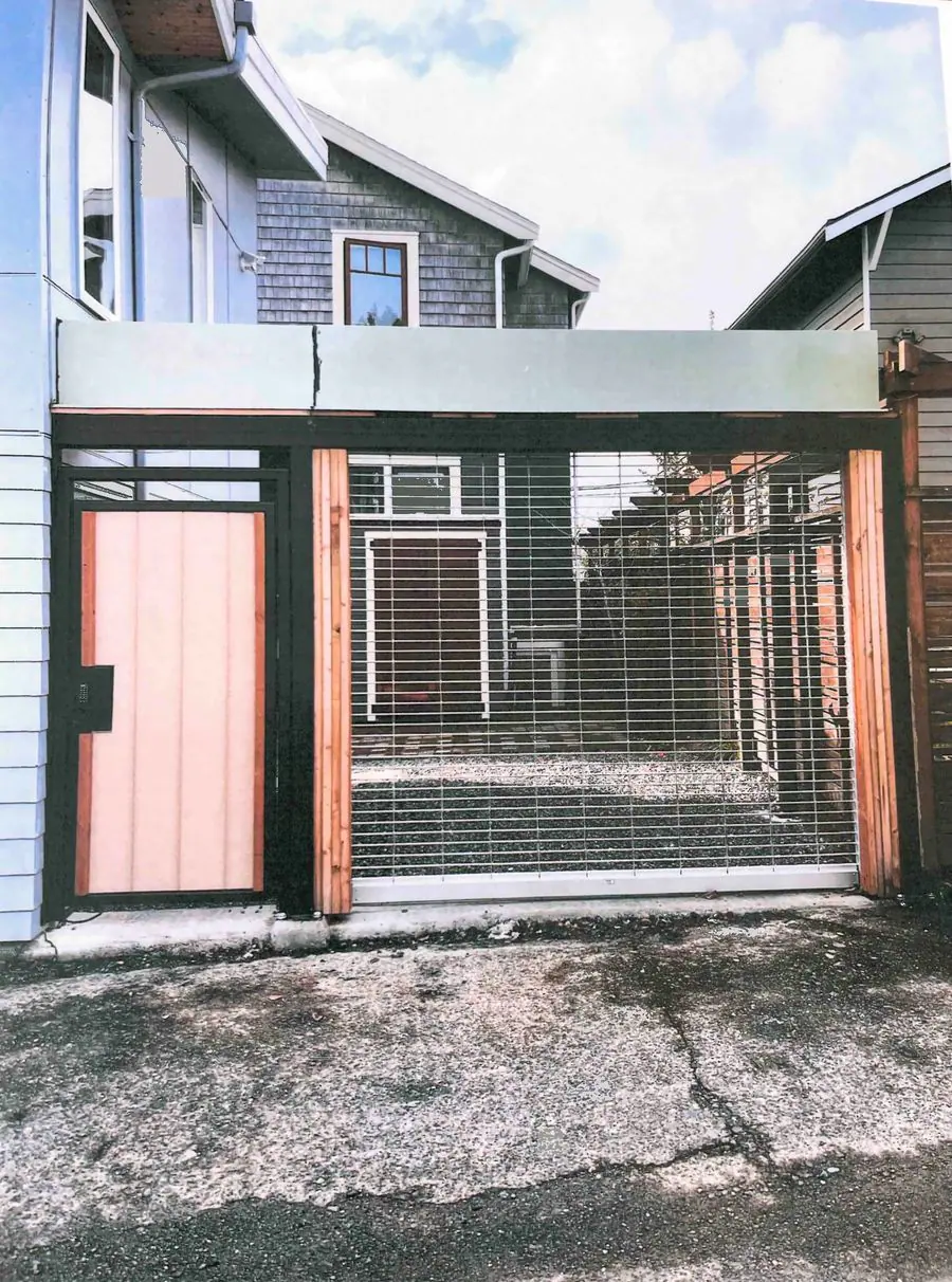 Rolling security grille across an alley entrance