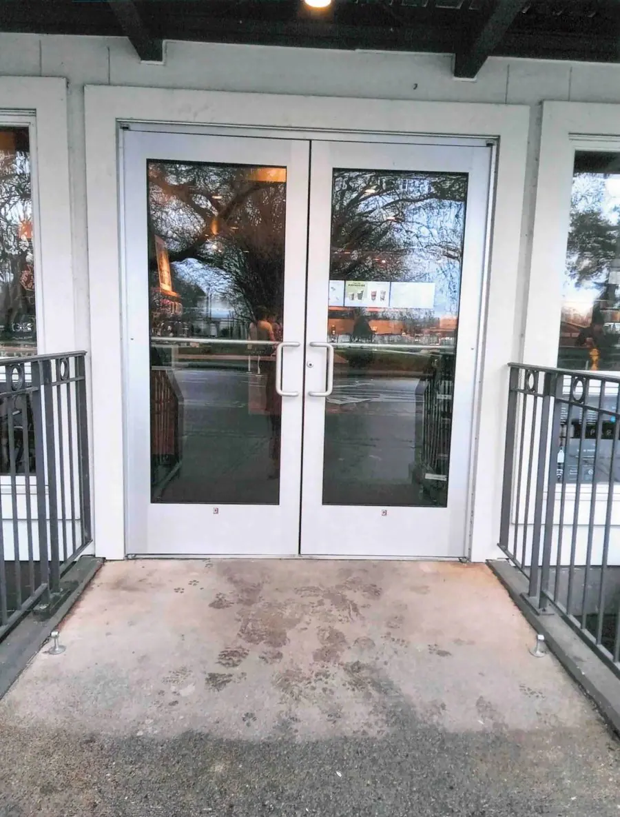 Pair of aluminum and glass storefront doors