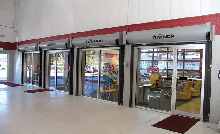 Lobby with four Raynor rolling fire doors mounted above glass storefronts