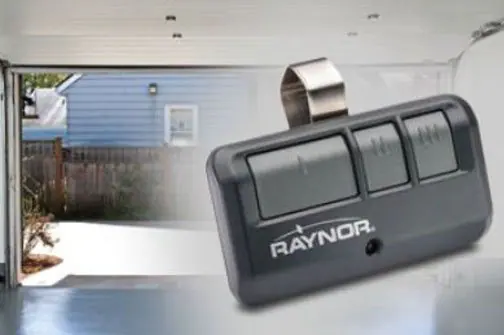 Garage door opener remote clipped to a car visor