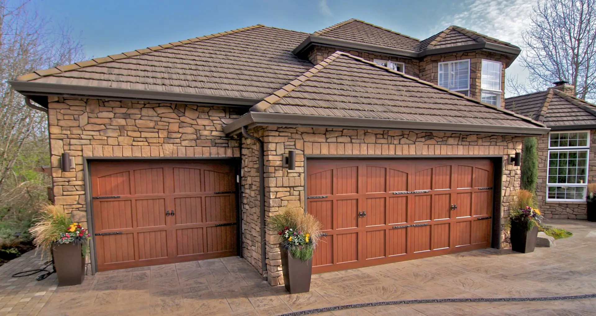 Home with two wood-look carriage house garage doors