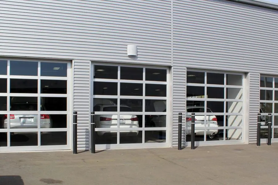 Aluminum and glass full-view doors on an auto service building